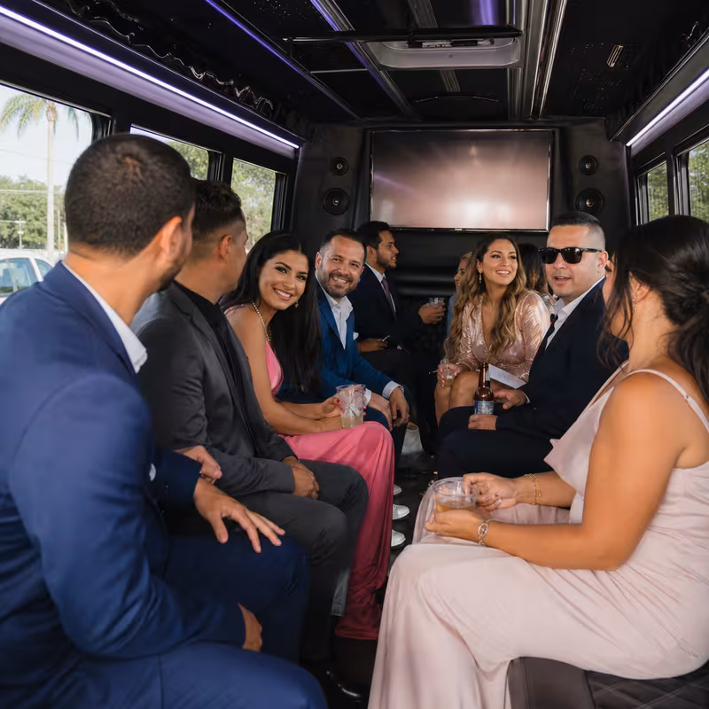 Wedding guests seated inside a Pembroke Pines party bus