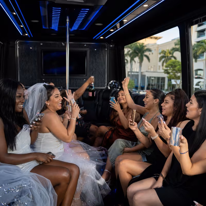 Party bus interior with wraparound leather seating and LED lighting in Pembroke Pines