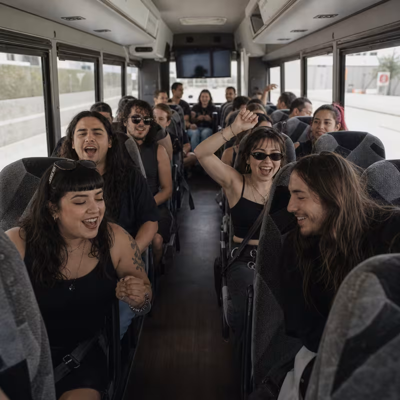 Party bus interior with wraparound leather seating and LED lighting in Pembroke Pines