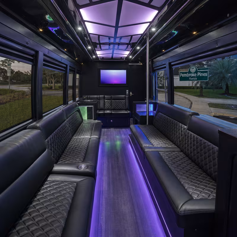 Party bus interior with wraparound leather seating and LED lighting in Pembroke Pines