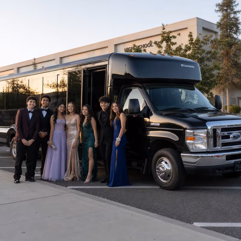 Group boarding a white charter bus for Prom & Homecoming Transportation transportation in Pembroke Pines