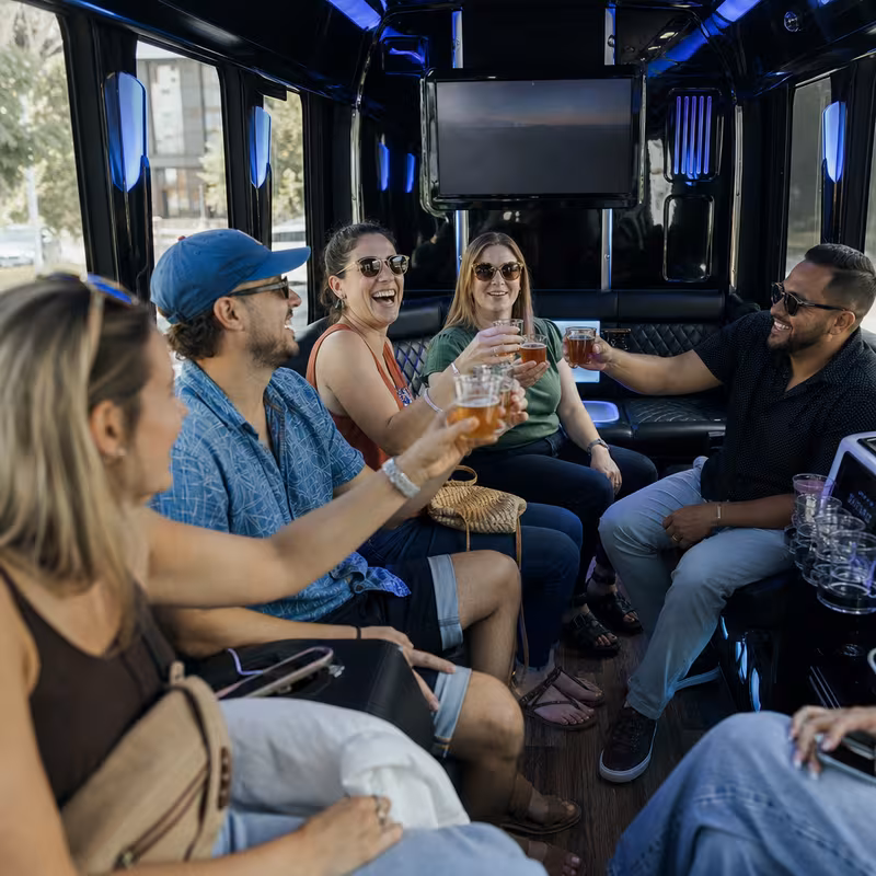 Group boarding a white charter bus for Winery & Brewery Tour Transportation transportation in Pembroke Pines