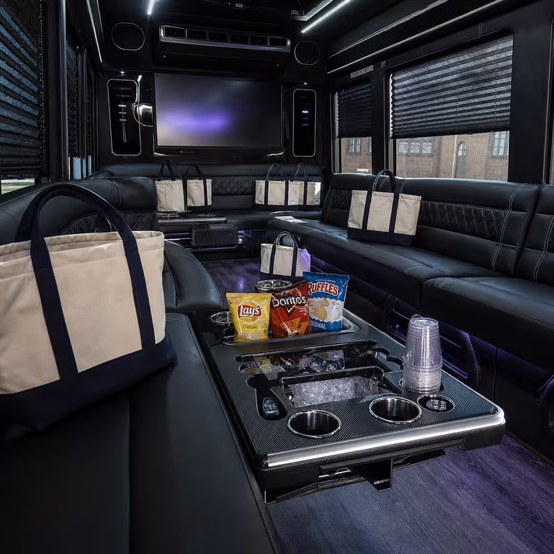Party bus interior with wraparound leather seating and LED lighting in Pembroke Pines